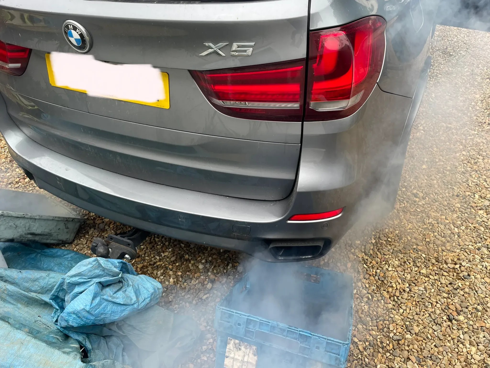 Mobile DPF cleaning being carried out on a BMW