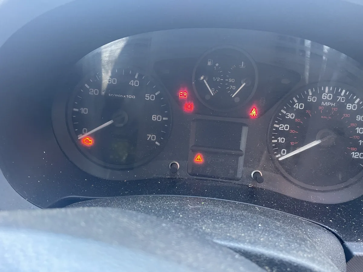 A Citroen dashboard in Aylesbury with several warning lights lit before a DPF clean